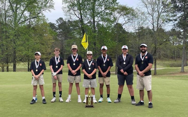 Pictured is the middle school boys team with their region runner-up trophy. Pictured left to right is Gavin Carter, Kaleb Hendrix, Andrew Brown, MJ Miller, Powell Chiang, Bo Osborne, and coach Mason Buchanan. 