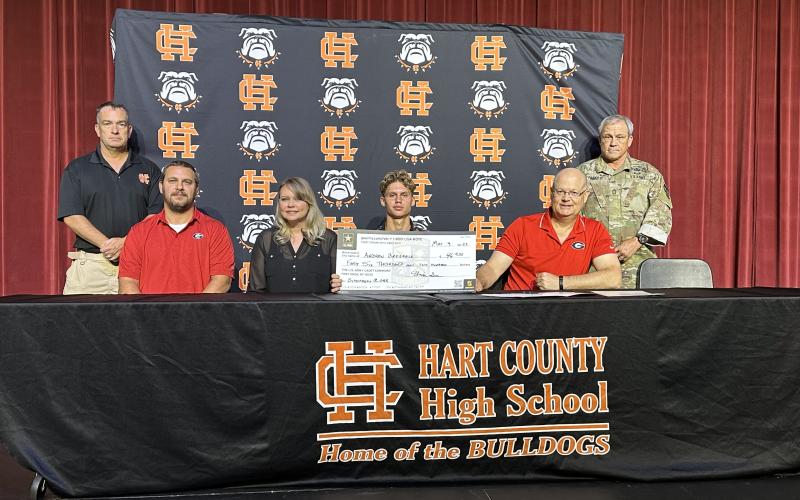 Pictured on the first row from left to right is Donnie Brezeale, Tilisha Brezeale, Andrew Brezeale (signee), and Kenneth Harris - UGA Army ROTC recruiting officer. Second row is Lieutenant Colonel Carter and MSG Fagan.