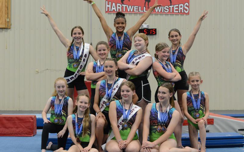 Pictured is the Hartwell Twister gymnastics team after competing in regionals in Pigeon Forge, Tennessee on May 13-14. First row from left to right is the bronze level: Kennedi Pennington, Charley Lloyd, and Adrianne Pennington. Second row from left to right is the silver: Tristyn Thompson, Julianne Bond, and Emma Kale Garland. Third row from left to right is the level four: Aeryn Back, Chastyn Haynie, and Gracen McAdams. Fourth row from left to right is the diamond: Madalyn Dault, Cheyenne Rucker, and Maci