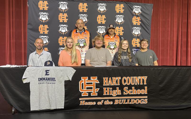 Pictured on the first row from left to right is Mark Johnson, Angie Johnson, Xander Patton (signee), Kinsey Allen, and Austin McCall. Second row is Joseph Carden and Charlie Milford.