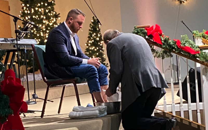 Pictured at the top is Dr. Brad Starnes as he humbly watches former senior pastor of Cornerstone Baptist Church Terry Meeks wash his feet.