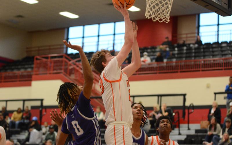 Pictured is senior forward Avery Strickland as he grabbed the put back to score in the 60-53 win over Monroe Area on Feb. 14.
