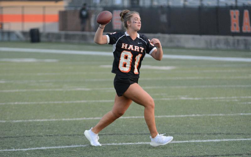 Pictured is Dakota Phillips as she looks  to pass while on the run, as she had four passing touchdowns.