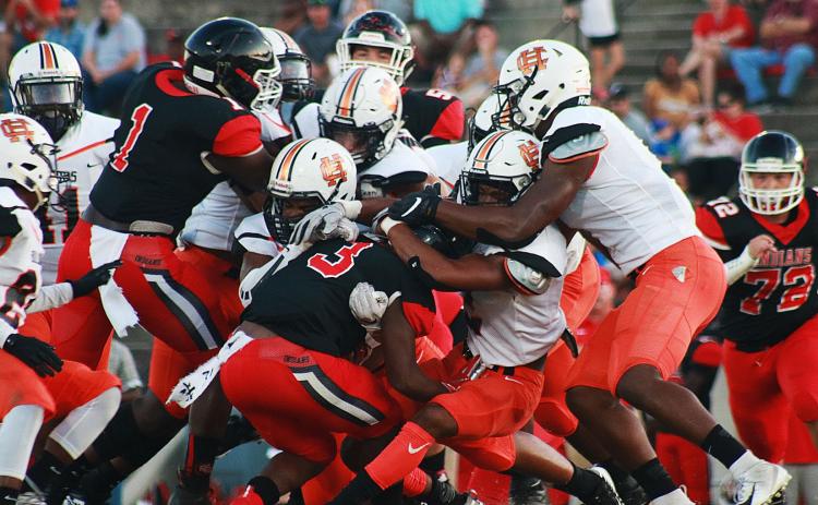 Sunshots by Grayson Williams -- Hart County’s defense swarms a Stephens County ball carrier on Aug. 30 in Toccoa. The Bulldogs went on to win 26-13.
