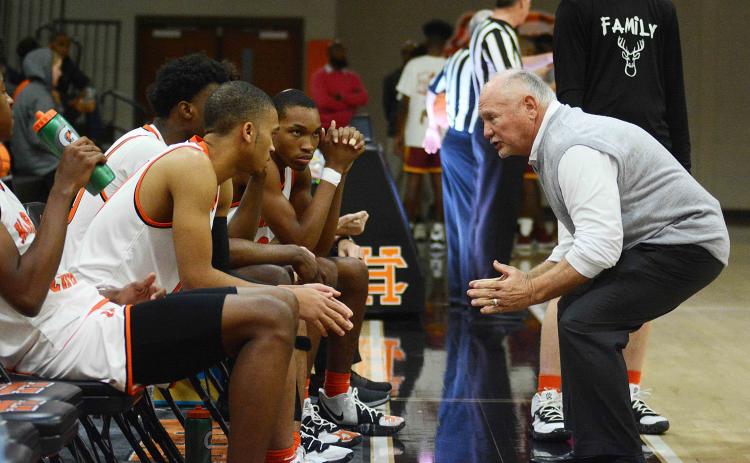 Sunshot by Michael Hall — Hart County head boys’ basketball coach Harry Marsh talks to his team prior to tip-off against Abbeville at home on Saturday in which the Bulldogs won 68-57, marking Marsh’s 650th win as a boys’ team head coach.