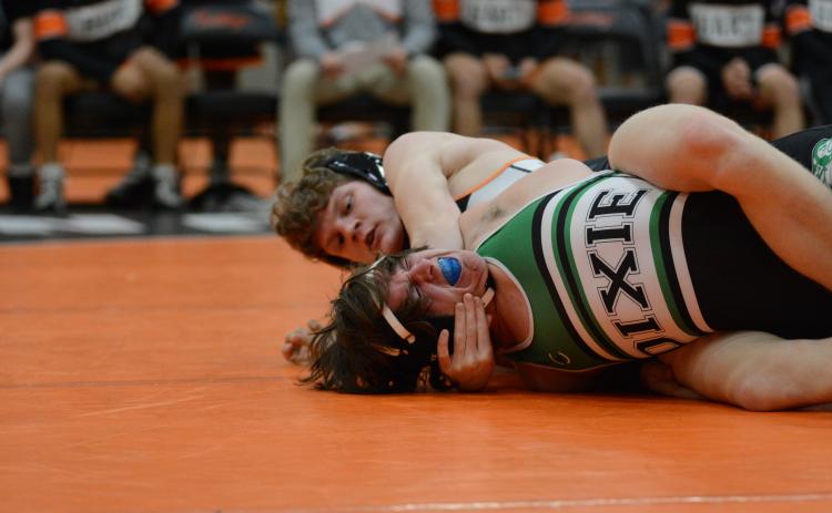 Ethan Stovall pins his opponent and wins his match during the Mat Dogs home meet against Dixie High School Jan. 16.