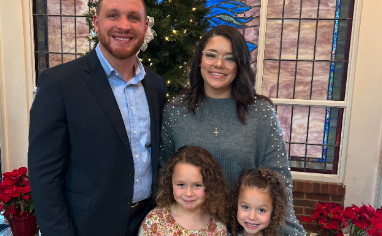 Pictured is the Starnes family after being voted in as the new senior pastor of Cornerstone Baptist Church. Pictured first row from left is Hope and Harper, and the second row from left Brad and his wife Jahna.