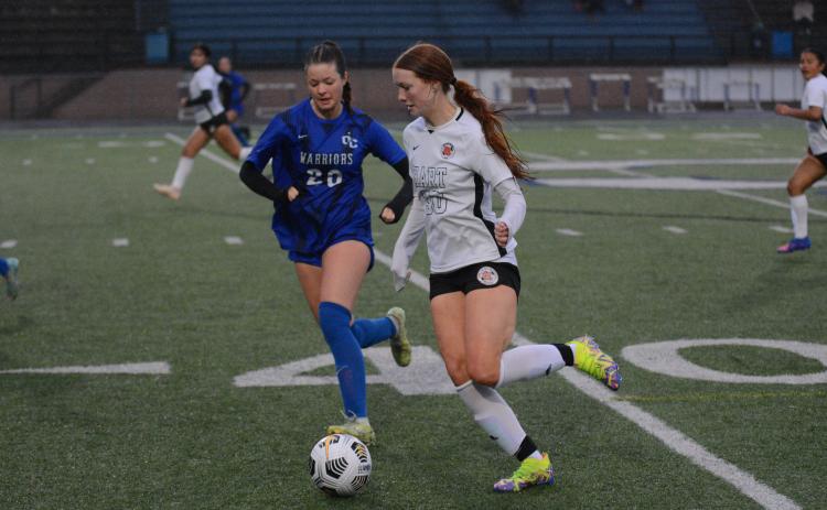 Junior forward Channing Segars dribbles the ball up the sideline in the 8-0 loss to the Lady Warriors of Oconee County. 