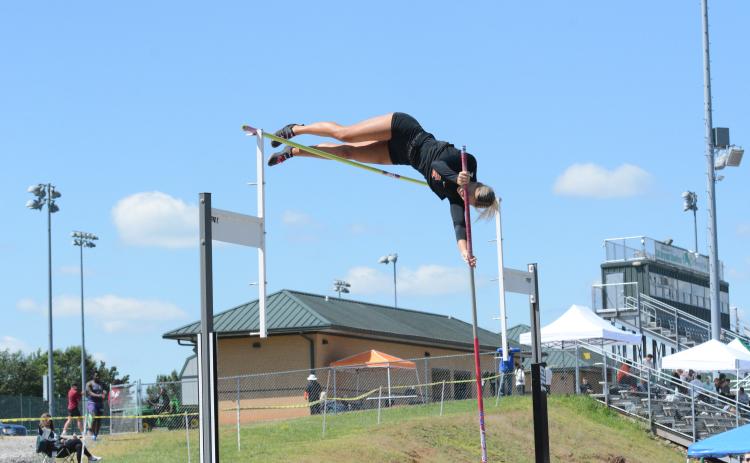Pictured is senior pole vaulter Amelia Johnson as she captured a region championship in her respective event.