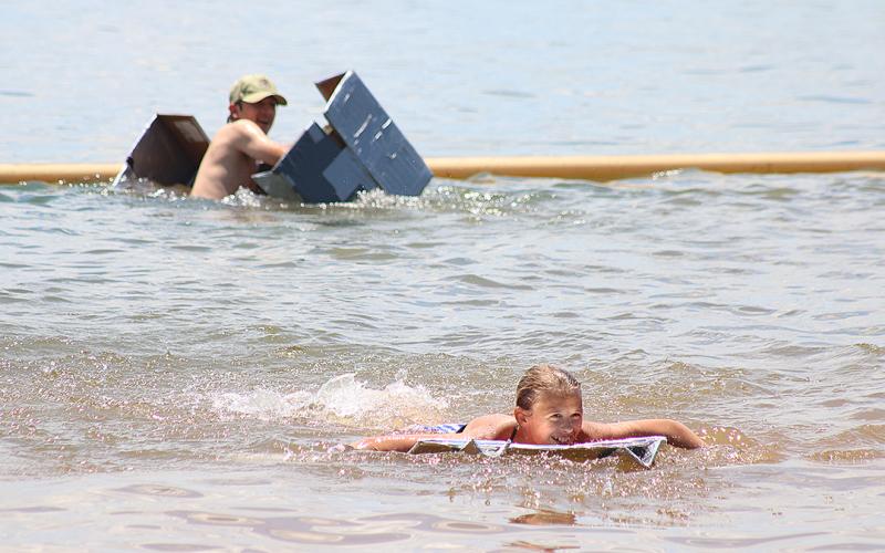 Bulldog band members compete to see who has the best makeshift boat.