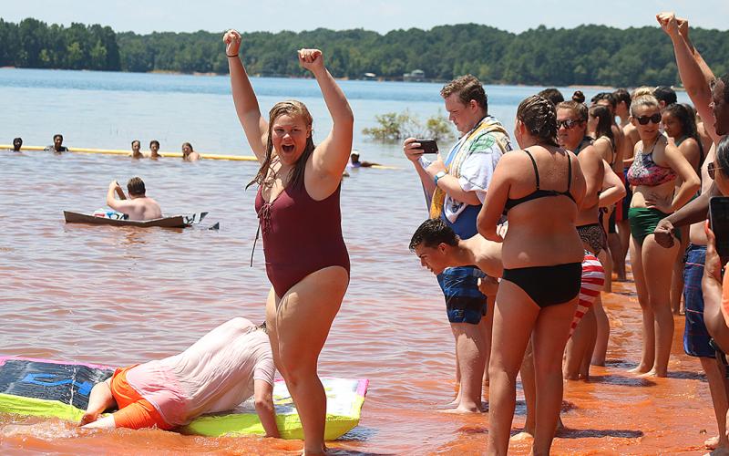 Bulldog band members compete to see who has the best makeshift boat.