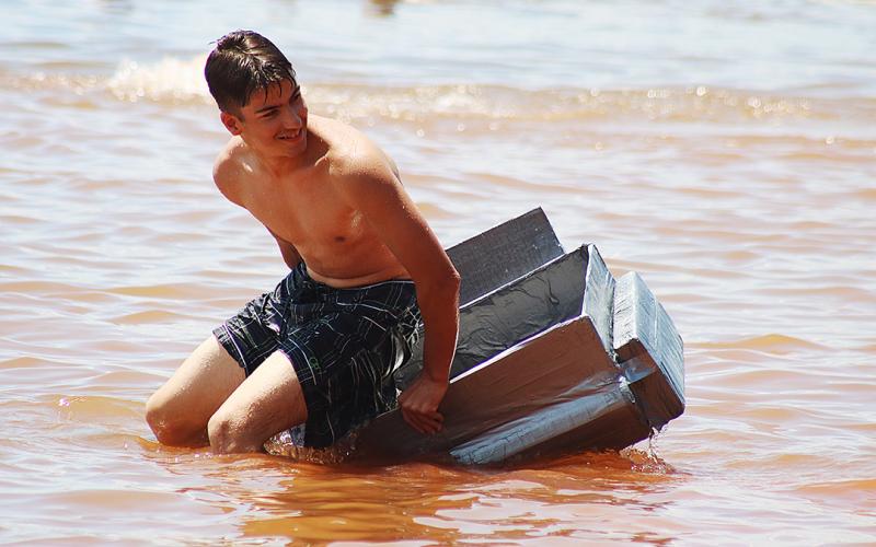 Bulldog band members compete to see who has the best makeshift boat.