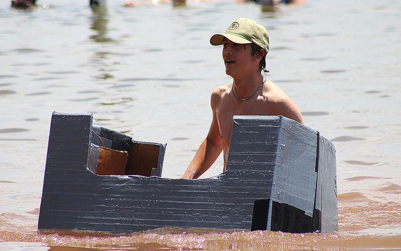Bulldog band members compete to see who has the best makeshift boat.