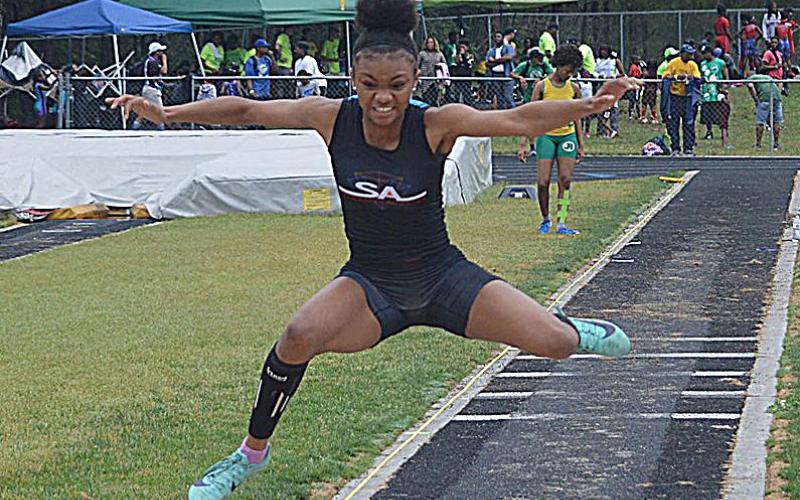 Valasha Carter competes in the triple jump at a recent event.