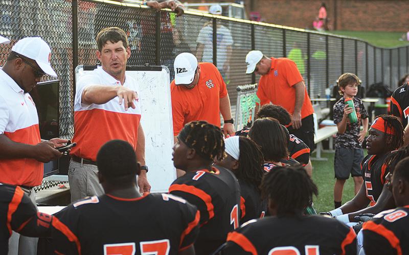 Defensive Coordinator Corey Dickerson talks to his team on the sidelines on Aug. 16.