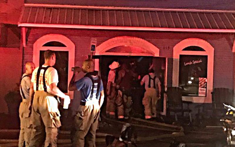 Hartwell firefighters work the scene early Friday at Little Japan, which caught fire shortly after 12:30 a.m.