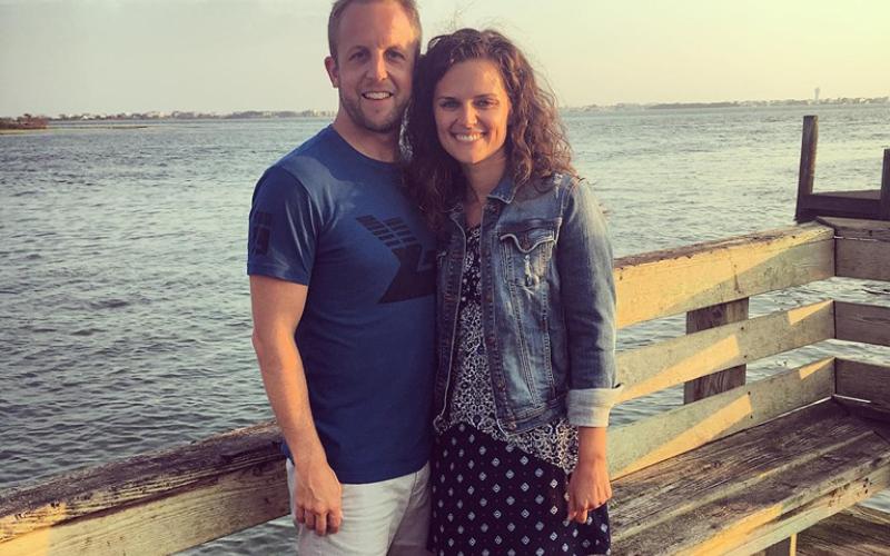 Scott and Megan Lykins pose for a photo. Megan is the new sports director for the Bell Family YMCA.