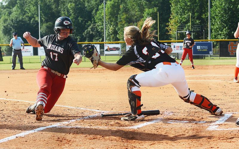 Sunshots by Michael Hall Hart County catcher Annslee Mitchell tags out Stephens County baserunner Kasey Westmoreland on Saturday at Hart County High School during the Lady Diamond Dogs’ 13-1 loss in the first game of the season.