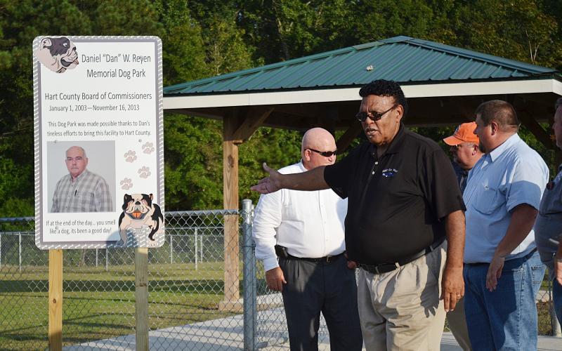 Sunshot by Michael Hall — Hart County Commissioner R.C. Oglesby talks during the dedication ceremony on Sept. 5 naming the dog park at the Hart County recreation complex after the late commissioner Dan Reyen.