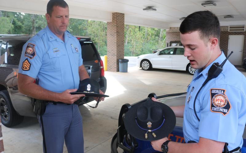 Sunshot by Grayson Williams — Georgia State Patrol Post 52 commander Tracy Webb, left, and Trooper Jesse Lamb, right, show off their trooper hats, which they say are a symbol of professionalism.