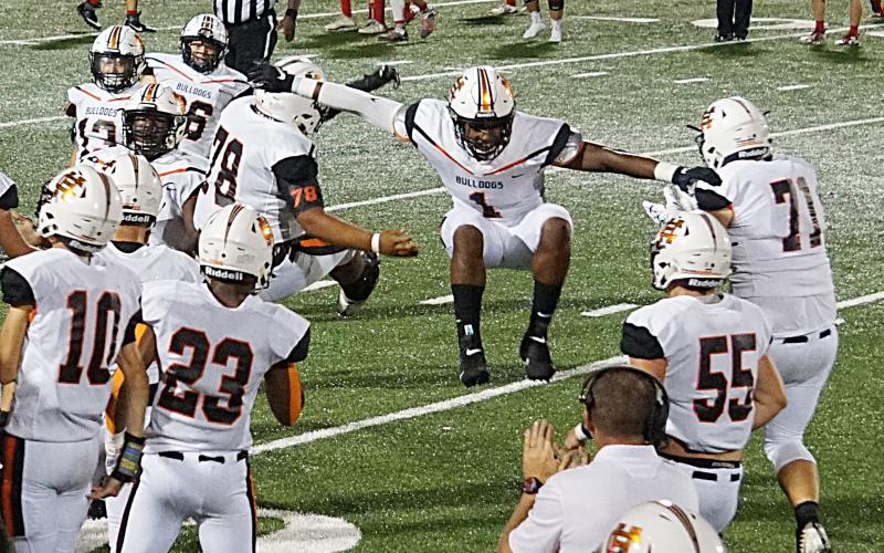 Photos submitted — Hart County’s Kaimon Rucker, No. 1, leaps as he celebrates a play on Sept. 14 in Madison County with Will Hardmon, No. 78, Caden Hart, No. 71, Seth Elrod, No. 55 and Malachi Kelley, No. 23.