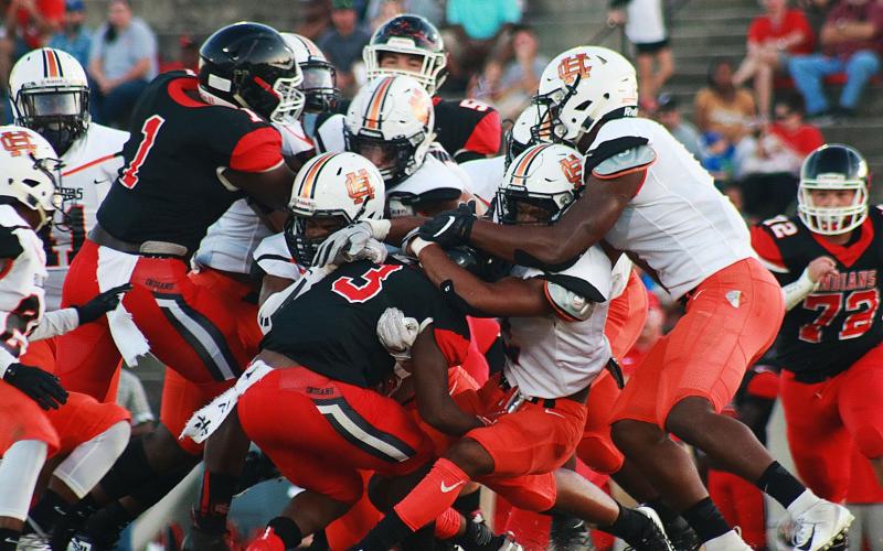 Sunshots by Grayson Williams -- Hart County’s defense swarms a Stephens County ball carrier on Aug. 30 in Toccoa. The Bulldogs went on to win 26-13.