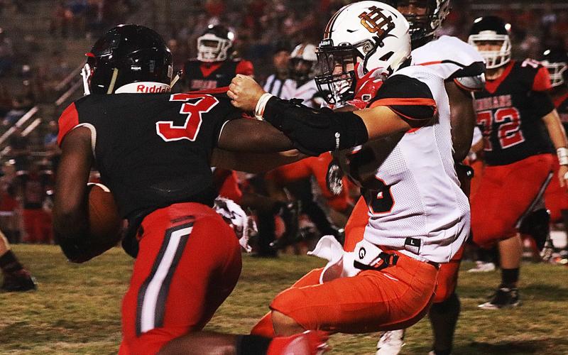 Sunshot by Grayson Williams -- Hart County’s Jackson Canup, above, pulls down Stephens County’s MJ Jones in Toccoa on Aug. 30 in the Bulldogs’ 26-13 victory over the Indians.
