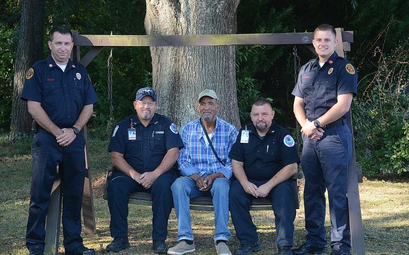 Sunshot by Michael Hall — Hartwell firefighter Jonathan Miller, from left, Hart County EMT Ronald Dutton, Raisel HM RA, Hart County EMT Ronnie Thompson and Hartwell firefighter Bobby Lewis pose for a photo after talking about the experience when the first responders, including firefighter John Moore and EMT Brian Evans, not pictured, saved HM RA’s life.