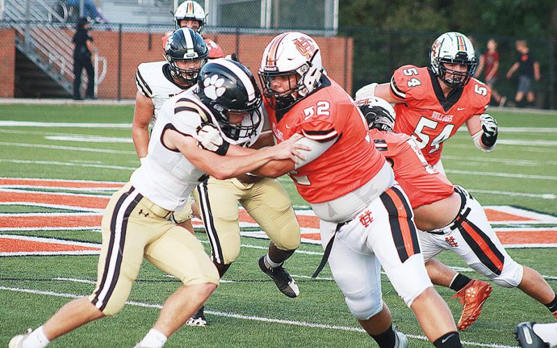 Sunshot by Grayson Williams — Gabriel Coker, No. 52, blocks for running back Malachi Thomas on a play in which Thomas broke a big run for a touchdown.