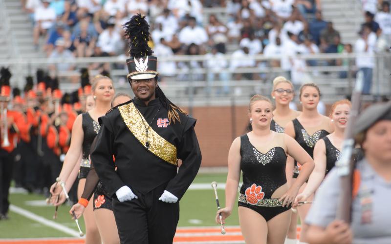 File photo — Drum Major Rendarris Gaines leads the Bulldog Band on the field this season.