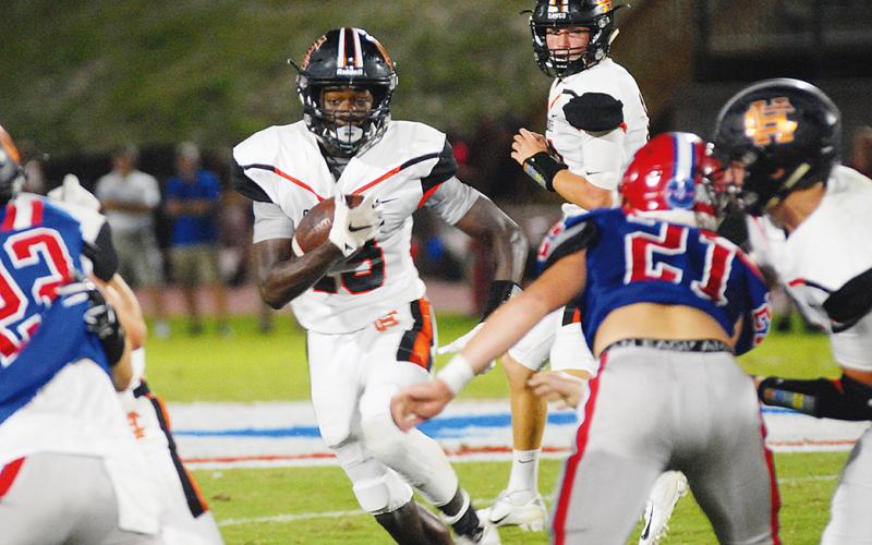 File photo — Malachi Thomas looks for running room in last year's game at Jefferson.
