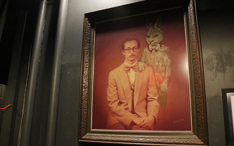 Sunshot by Grayson Williams — This picture of the Rev. Harry Hannah and Harvey the rabbit inexplicably falls off the wall in Hart County Community Theater on Depot Street due to what people think is a haunting.