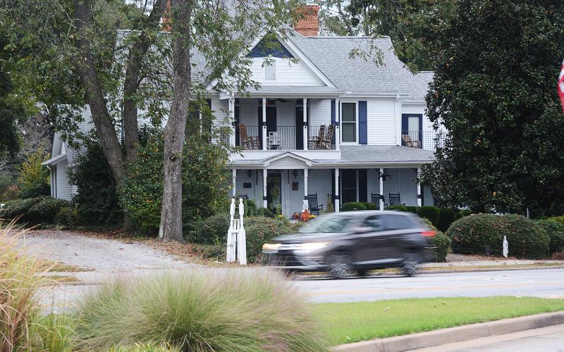 Sunshot by Michael Hall — Traffic passes on Benson Street Wednesday morning in front of the Skelton house.