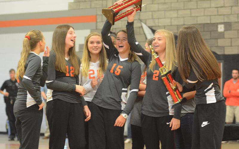 Sunshot by Michael Hall — Brooklyn Hubbard, Ryann Williamson, Abby Hubbard, Ella Franklin, Hannah Harris and Lillie Kate Rogers show off their North Georgia State Championship trophy at a pep rally on Oct. 7 at Hart County Middle School.