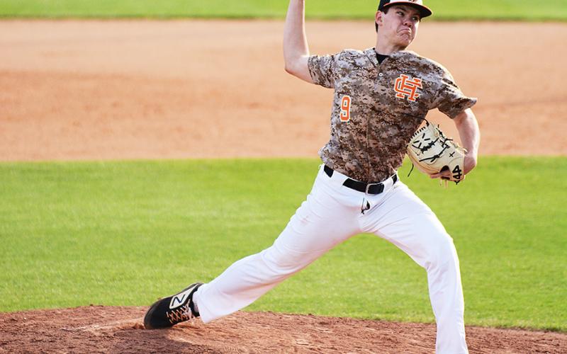 Sunshot by Grayson Williams. Casey Tallent pitches in April against Franklin County.