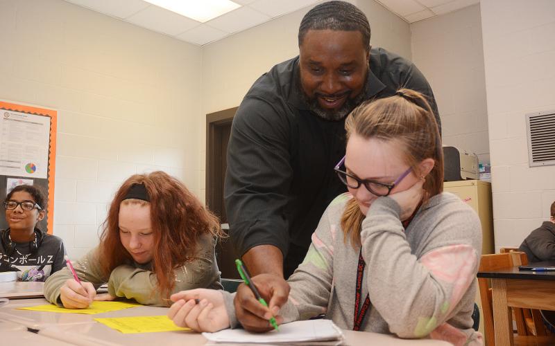 Sunshot by Michael Hall — Middle school teacher Earl Fouch helps students during a math exercise at Hart County Middle School on Monday, Nov. 4.