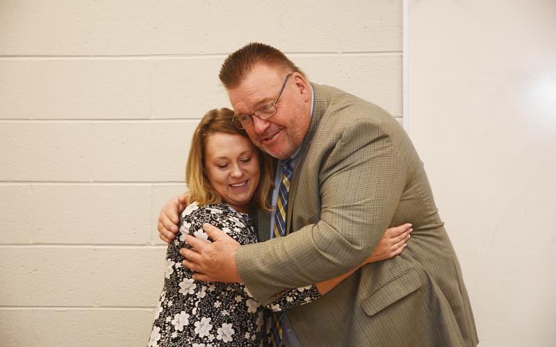 Sunshot by Michael Hall — Hart County Teacher of the Year Christie Simpson, left, hugs Superintendent Jay Floyd on Nov. 15 at the Hart College and Career Academy’s community room after she was announced as the system-wide winner of the award.