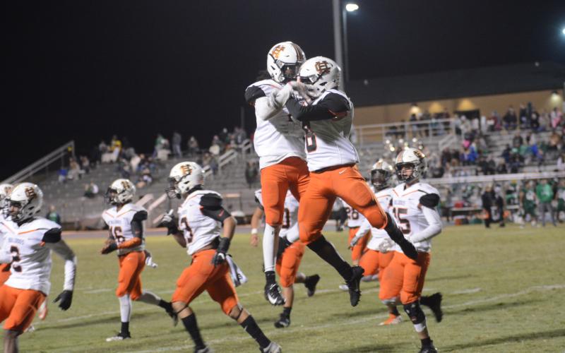 Bulldog players celebrate after a touchdown against Franklin County on Nov. 1.