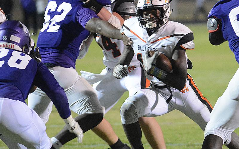 Sunshot from file by Grayson Williams - Malachi Thomas, No. 19, celebrates a touchdown with quarterback Luke Lee during the 2019 Hart County football season.