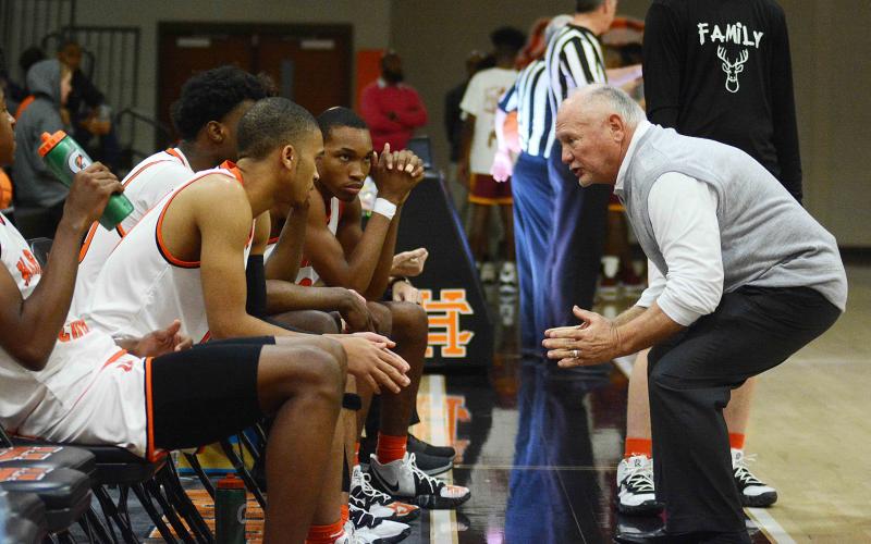 Sunshot by Michael Hall — Hart County head boys’ basketball coach Harry Marsh talks to his team prior to tip-off against Abbeville at home on Saturday in which the Bulldogs won 68-57, marking Marsh’s 650th win as a boys’ team head coach.