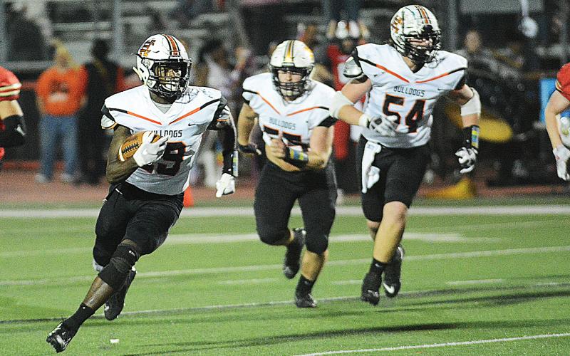 Sunshot by Grayson Williams - The Bulldogs’ defense pulls down Greater Atlanta Christian quarterback Jackson Hardy on Nov. 29 in Norcross in Hart County’s season-ending 17-16 loss to the Spartans.
