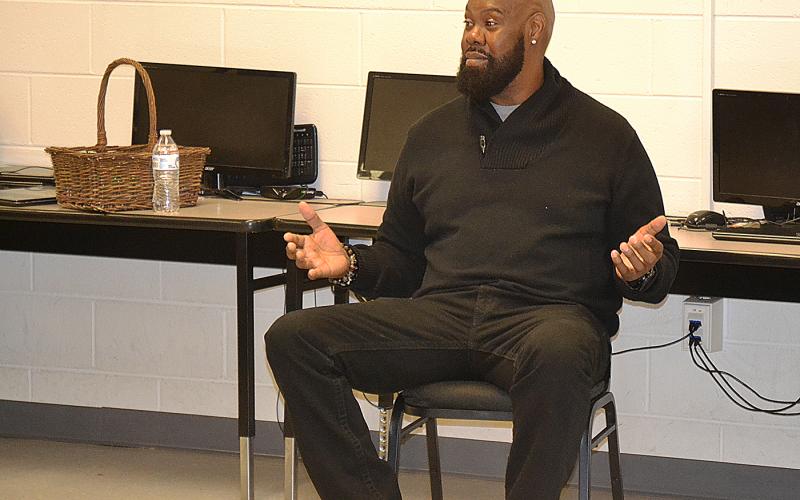 Sunshot by Drew Dotson - Former NFL offensive lineman and Royston native Tony Jones talks to students at the Hart County Alternative Program on Wednesday, Dec. 6.