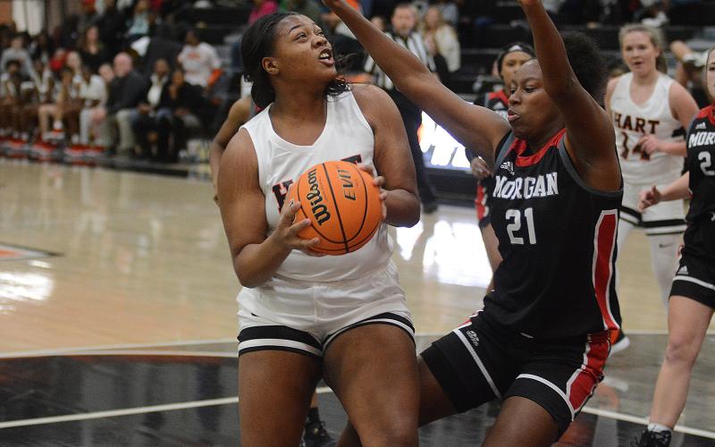 Sunshot by Grayson Williams - Taniya Alexander fights to get a shot up under the basket on Dec. 6 against Morgan County at Hart County High School.