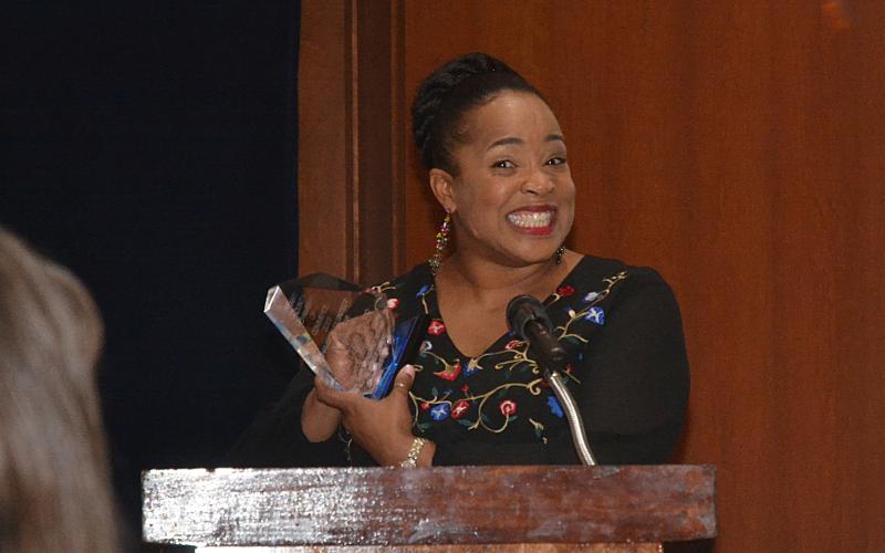 Sunshots by Michael Hall Kristie Rucker smiles as she speaks to the crowd at the annual Hart County Chamber of Commerce Awards Banquet after winning the Volunteer of the Year Award.
