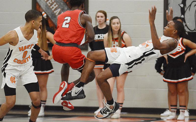 Hart County Junior Shone Webb falls backward after colliding with Stephens County’s Chris Sinclair at Hart County High School on Jan. 24.