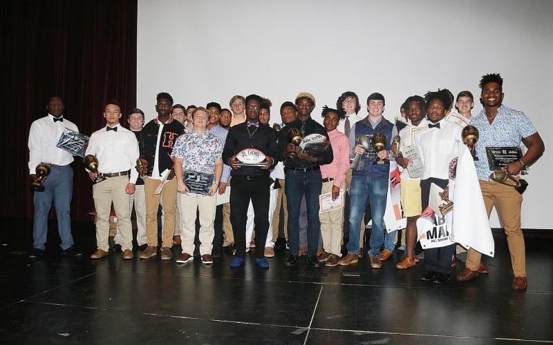 Sunshot by Grayson Williams - Hart County Football award winners show off their awards after the Hart County Football banquet on Jan. 16.Sunshot by Grayson Williams Hart County Football award winners show off their awards after the Hart County Football banquet on Jan. 16.