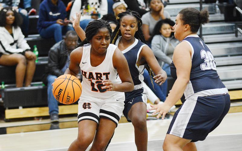 Sunshot by Grayson Williams - Hart County’s Shakendra Grove drives the baseline in the McDonald’s Shootout championship game on Dec. 30 at Hart County High School. The Lady Dotgs’ took second place in the tournament.