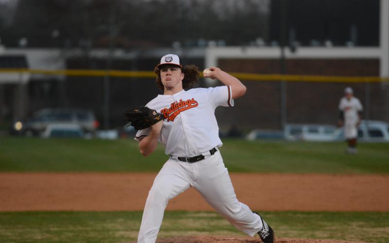Sunshot by Grayson Williams - Hart County pitcher Peyton Powell deals on Friday, Feb. 14, at Saye Field at Hart County High School in the Diamond Dogs’ opening night win.