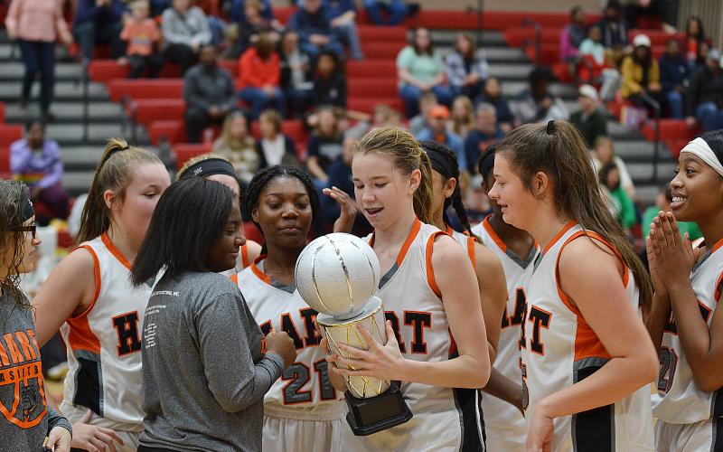 Sunshots by Michael Hall - The Hart County Middle School eighth-grade Lady Dogs celebrate their NEGIAA championship on Feb. 1 at Madison County Middle School.