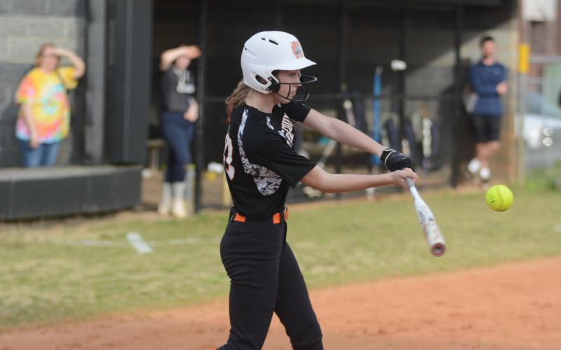 Sunshot by Grayson Williams - Emilee Sanders swings at a pitch in Hart County’s slow-pitch softball game last week against East Jackson.
